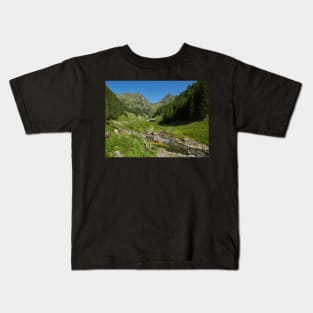 Wooden house in a mountain landscape Kids T-Shirt